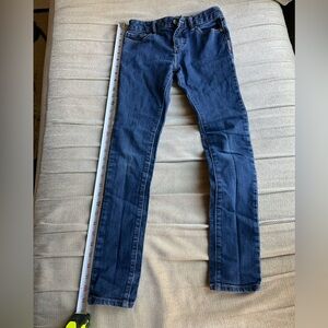 Old Navy size 12 super skinny blue jeans with adjustable waist band.